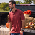 Load image into Gallery viewer, Man in a red polo shirt standing next to a pickup truck