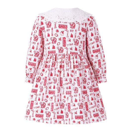 Back view flat lay of the Babycakes Smocked Dress in Alabama, white dress with a crimson elephant, houndstooth, and 'T-TOWN 1831' print and an eyelet collar.
