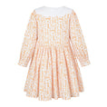 Load image into Gallery viewer, Back view of the Babycakes Smocked Dress in Tennessee, cream fabric with an orange hound and 'TN' motif print, white eyelet collar.
